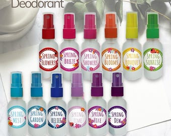 May include: Twelve small glass bottles with colorful lids and labels that say "Spring" followed by a different word on each bottle. The bottles are arranged in two rows of six. The text "Natural Deodorant" is at the top of the image. The text "For God's Glory Farm" is at the bottom of the image.