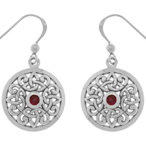May include: Silver dangle earrings with a red gemstone in the center of a Celtic knot design.