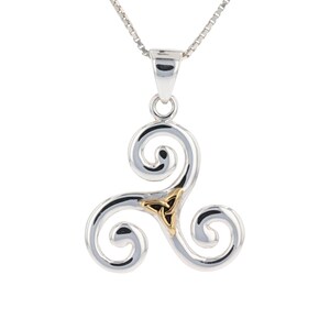 May include: Silver pendant necklace with a gold Celtic knot design. The pendant is in the shape of a triskelion, a symbol of three interconnected spirals.