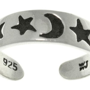 May include: Sterling silver toe ring with a crescent moon and four stars design. The ring is marked "925" on the inside.