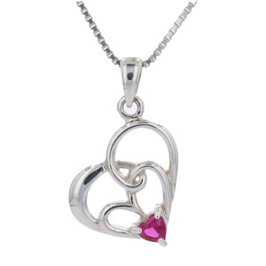 May include: A silver necklace with a heart-shaped pendant featuring a pink gemstone in the center.