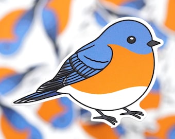 May include: A bluebird sticker with a white belly and orange breast. The bird is facing right and has a black eye and beak.