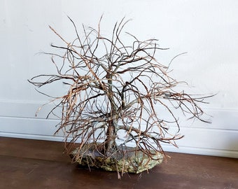 Copper wire tree on stone base