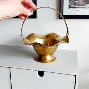 Scalloped brass basket with vintage braided handle