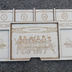 May include: A wooden game organizer for the board game Aeon's End. The organizer has compartments for the deck, discard pile, and four breach levels. The organizer also has a player mat with the Aeon's End logo and artwork of the game's characters.