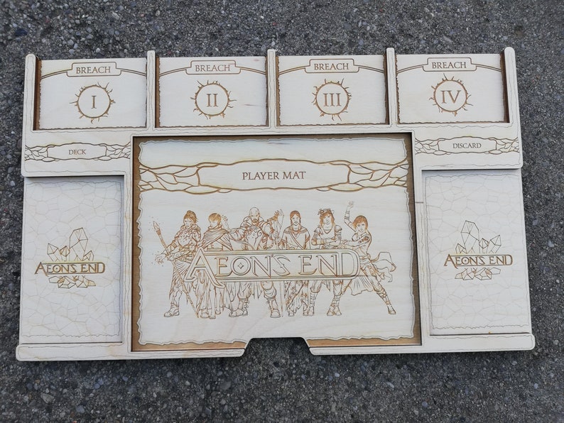 May include: A wooden game organizer for the board game Aeon's End. The organizer has compartments for the deck, discard pile, and four breach levels. The organizer also has a player mat with the Aeon's End logo and artwork of the game's characters.
