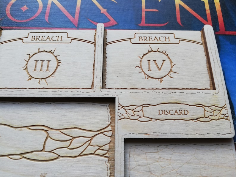 May include: Close-up of a wooden game board with two sections labeled "Breach" and a third section labeled "Discard". The Breach sections have Roman numerals III and IV, respectively.