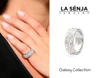 May include: A silver ring with a band of sparkling crystals. The ring is part of the Galaxy Collection by La Senja Jewelry.