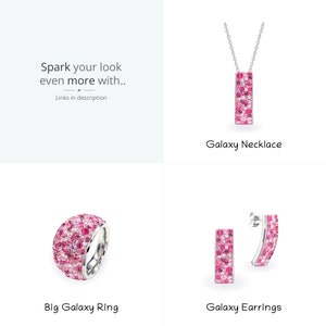 May include: A set of pink and silver jewelry featuring a necklace, ring, and earrings. The jewelry is decorated with small pink stones.