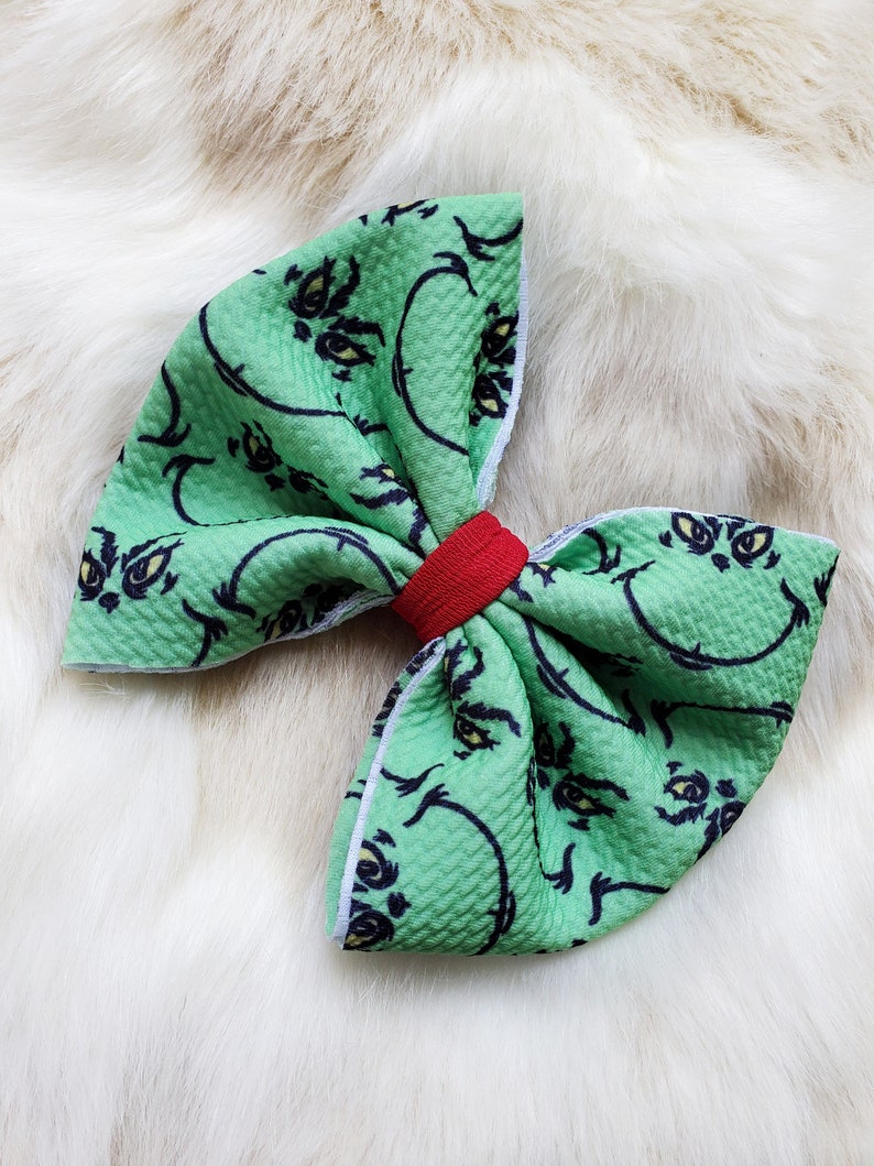 Grinchy man Christmas headband bow with or without Grinch heart.