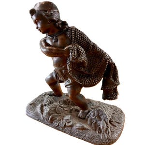 bronze fisher with net Boy Fishing Bronze Sculpture