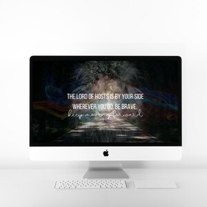 May include: A computer screen displaying a motivational quote: "The Lord of Hosts is by your side wherever you go. Be brave. Keep moving forward." The background is a dark forest with a path leading through it, and colorful ribbons and lights.