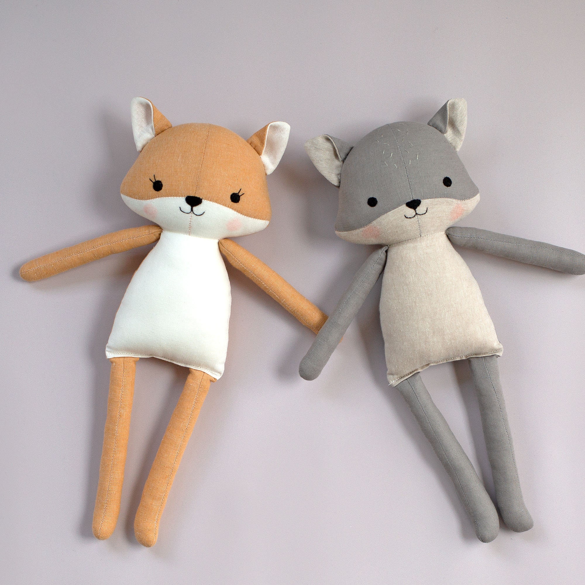 Handmade yarn fox toys in different postures and colors on Craiyon