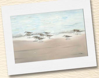 May include: A watercolor painting of a flock of small brown and white birds walking on a sandy beach. The birds are walking in a line, and the beach is a light brown color. The background is a light blue sky with white clouds.