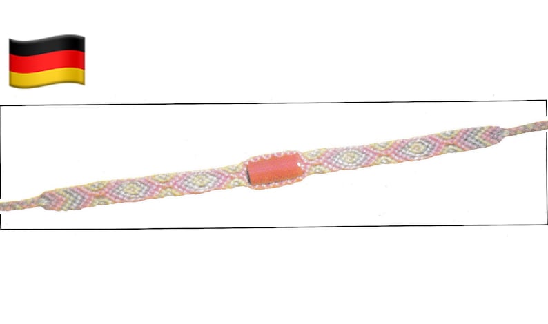 May include: A woven friendship bracelet with a central rectangular coral-coloured bead. The bracelet features a repeating pattern of pink, yellow, and white threads. The ends are finished with braided strands.