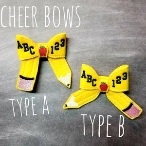 May include: Two yellow felt cheer bows shaped like pencils, with the text "ABC 123" and a red apple. The bows are labeled "Type A" and "Type B". The text "CHEER BOWS" is at the top.