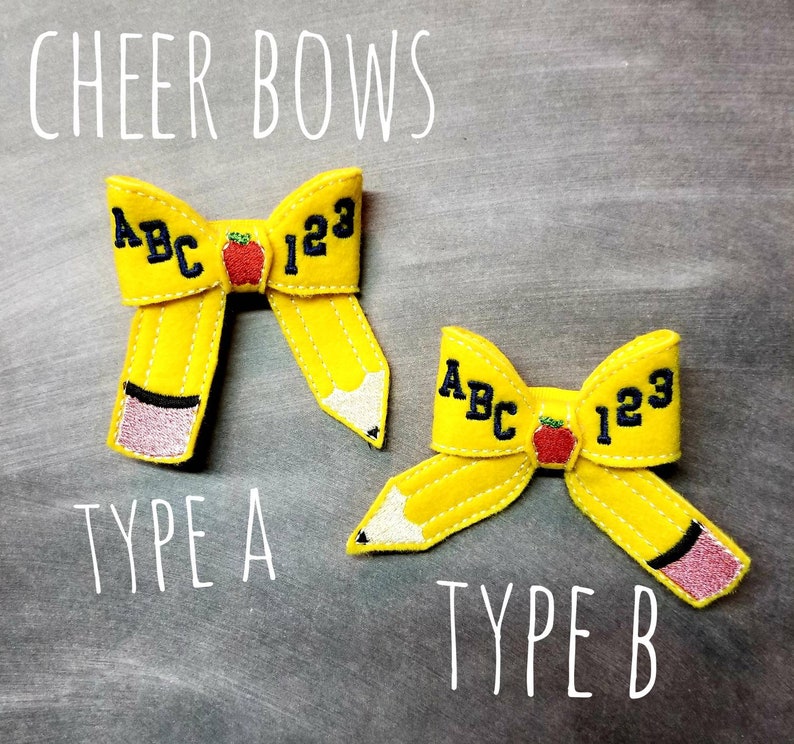 May include: Two yellow felt cheer bows shaped like pencils, with the text "ABC 123" and a red apple. The bows are labeled "Type A" and "Type B". The text "CHEER BOWS" is at the top.