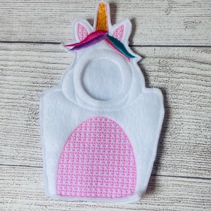 May include: White felt unicorn costume with a pink embroidered mane and a gold horn. The costume has a hole for a face.