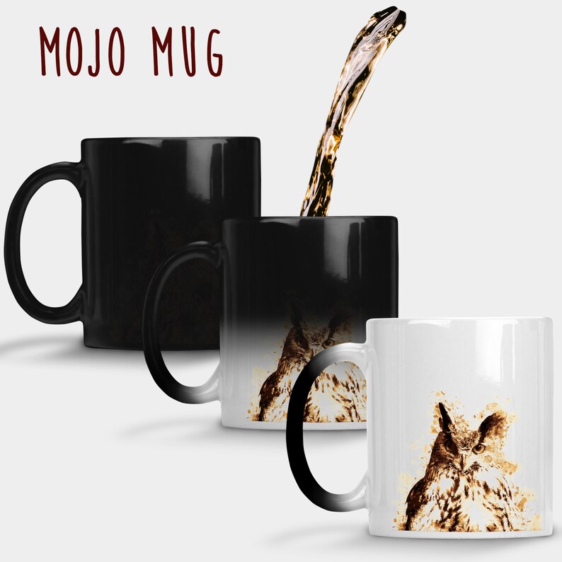 May include: A black heat-sensitive mug with the text "MOJO MUG" and a watercolor owl design. When hot liquid is added, the mug transforms, revealing the owl image. A stream of liquid is being poured into the mug.