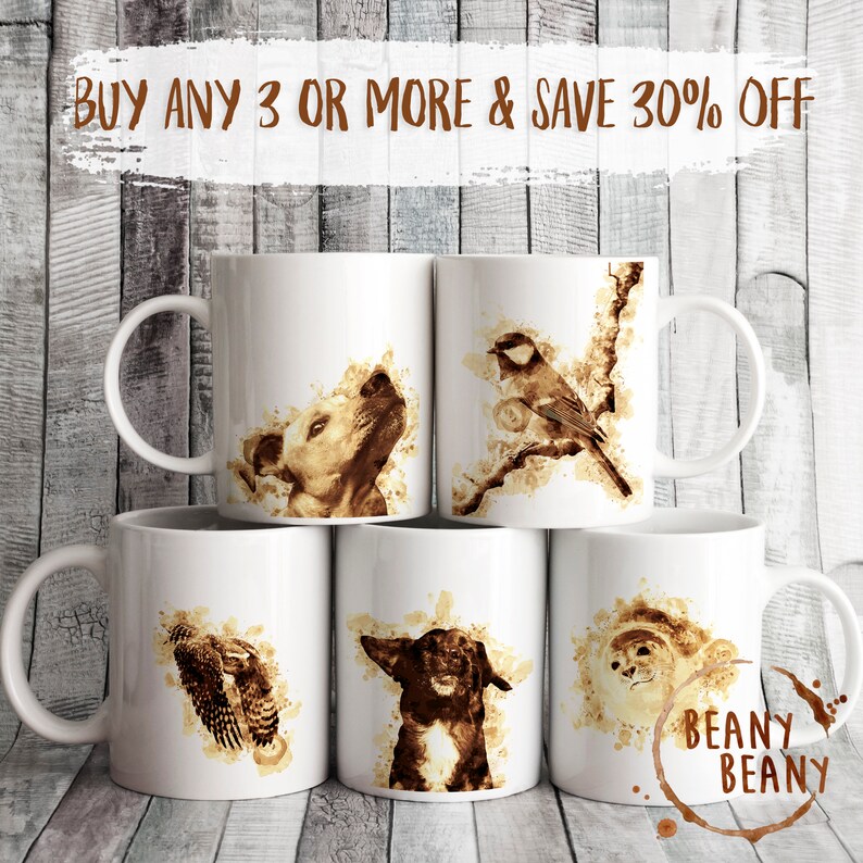 May include: White ceramic mugs featuring sepia-toned animal illustrations: a dog, a bird, an owl, and a dog. The mugs have a curved handle and the text "BUY ANY 3 OR MORE & SAVE 30% OFF". The brand name "BEANY BEANY" is also visible.