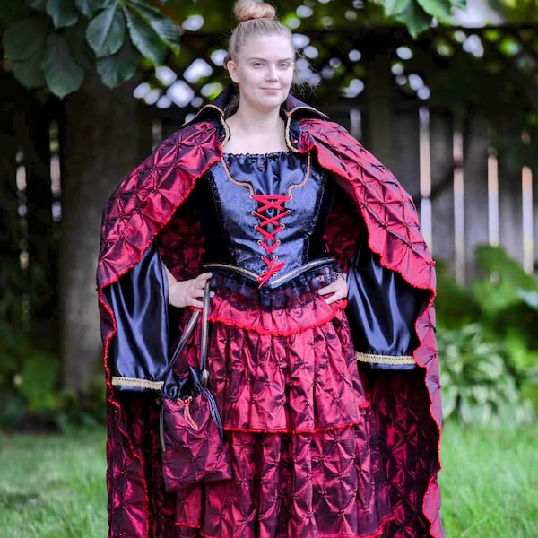 5 pc. Pirate or Vampire costume. Cloak, full skirt, peasant blouse, bodice laced vest and satchel. Color changing red sateen cloak/skirt.