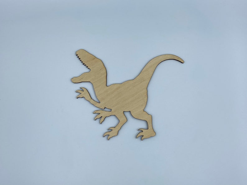painted wooden dinosaur cutouts
