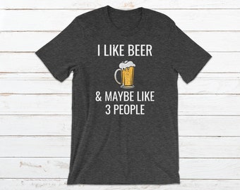 May include: Dark gray t-shirt with white text that reads "I like beer & maybe like 3 people". A cartoon image of a beer mug is above the text.