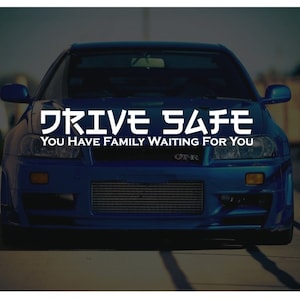 May include: A blue sports car with the text "DRIVE SAFE YOU HAVE FAMILY WAITING FOR YOU" on the front bumper.
