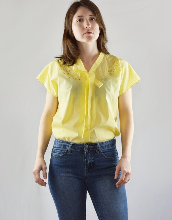 pastel yellow blouse