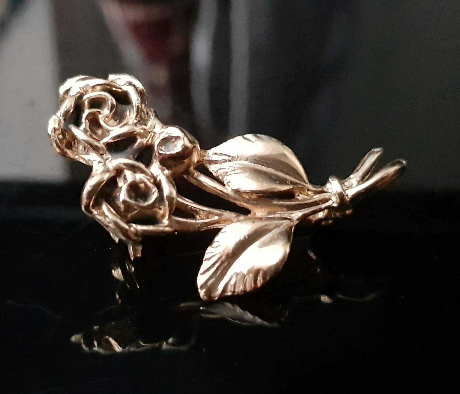 Gold rose brooch deals