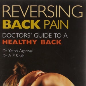 May include: Book cover titled "Reversing Back Pain" with the subtitle "Doctors' Guide to a Healthy Back." The cover features a person with their head resting on their arms. Authors are Dr. Yatish Agarwal and Dr. A. P. Singh.