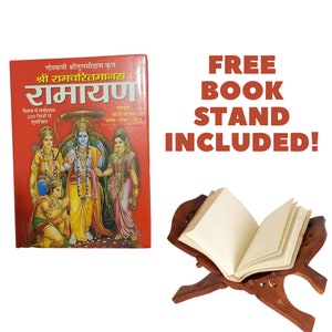 May include: A red book titled "Ramayan" with illustrations of Hindu deities, and a wooden book stand. The text "FREE BOOK STAND INCLUDED!" is displayed in red. The book has text in a foreign language.