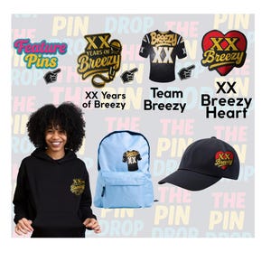 May include: A set of embroidered patches featuring a heart, a jersey, and a microphone. The patches are all black with gold lettering and accents. The heart patch is red with gold lettering. The patches are displayed on a colorful background with the text "Pin Drop The Pin".