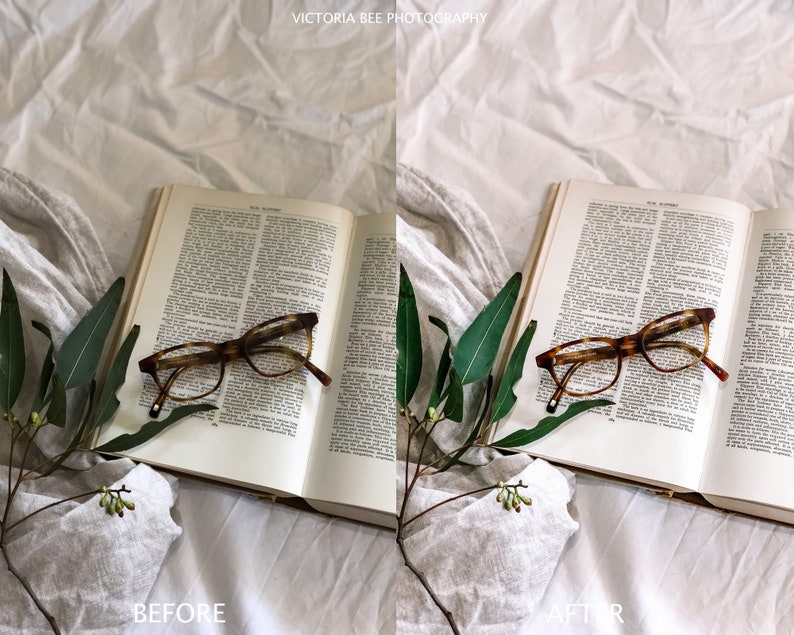 May include: A book with a pair of tortoiseshell glasses resting on top of it. The book is open and the pages are filled with text. A sprig of green leaves is on the left side of the book. The book and glasses are on a white linen surface.
