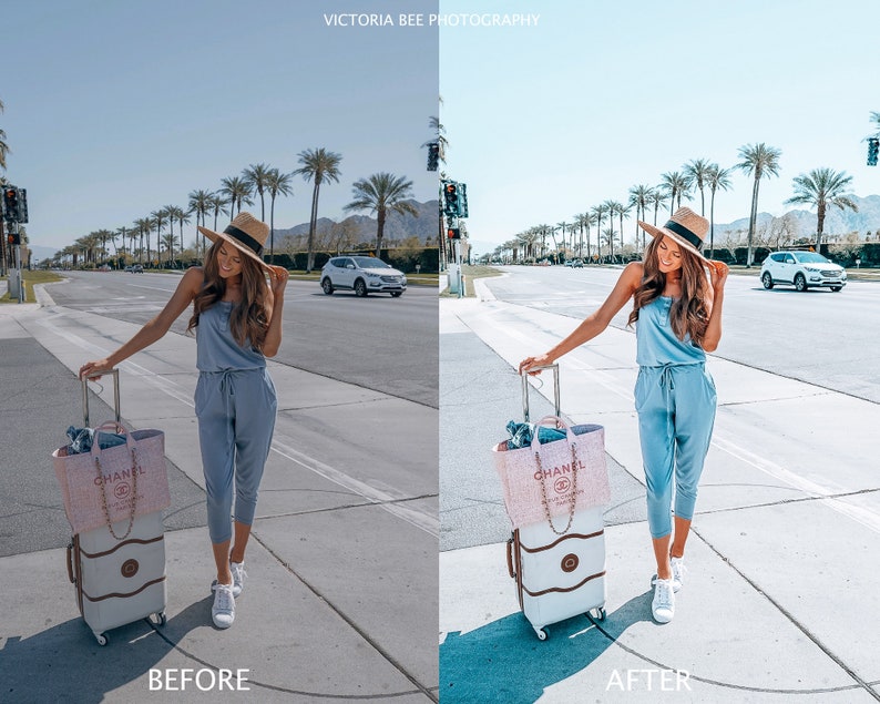 May include: A woman in a light blue jumpsuit and a straw hat is standing on a sidewalk with a suitcase and a pink Chanel bag. She is looking at the camera. The background is a street with palm trees and cars.