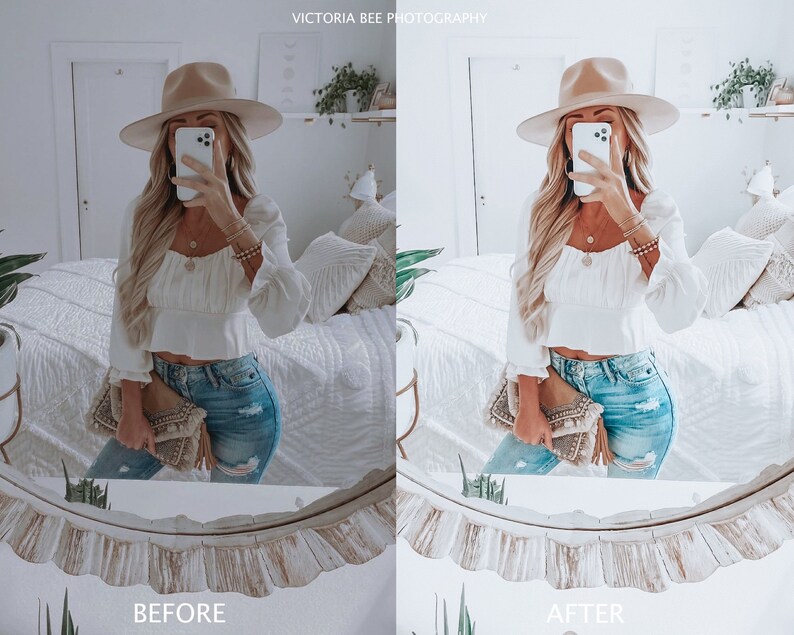 May include: A woman wearing a white crop top, blue jeans, and a wide-brimmed hat is taking a selfie in a mirror. She is holding a brown clutch purse.