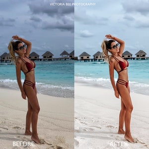 May include: A woman in a red bikini stands on a white sandy beach with turquoise water and overwater bungalows in the background.
