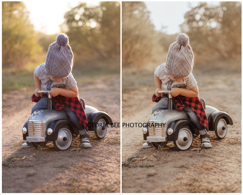 May include: A young child wearing a gray knitted hat with a pom-pom sits in a gray toy car with a red and black plaid blanket draped over the back. The child is looking down at the steering wheel. The car is on a dirt path with trees in the background.