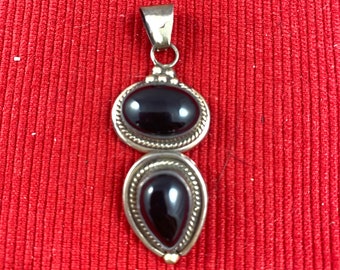 Navajo sterling silver and onyx pendant