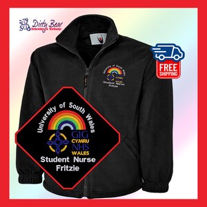 May include: Black zip-up fleece jacket with embroidered logos. The jacket features the text "University of South Wales Student Nurse Fritzie" and a rainbow design. The jacket also has the "Dirty Bear Embroidery & Workwear" logo.