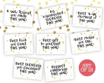 May include: Set of 18 printable cards with gold stars and black text. Each card features a different end-of-year reflection prompt, such as "Best Book You Read This Year" and "Biggest Challenge This Year".