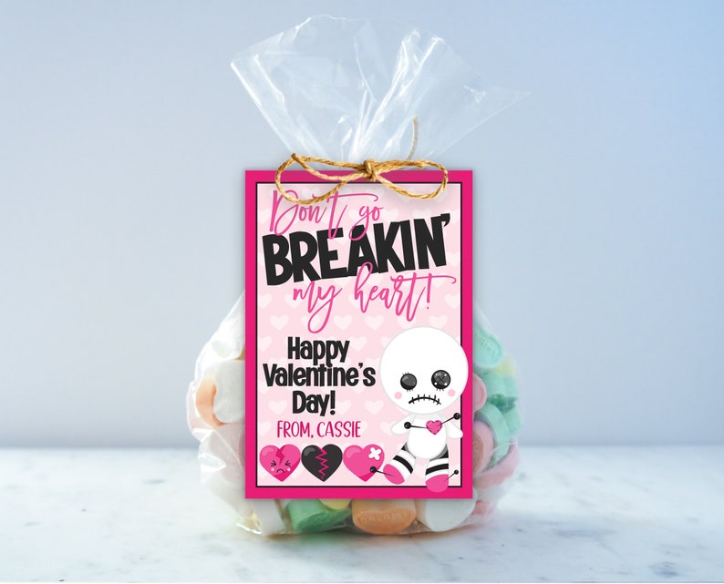 May include: Pink and black Valentine's Day gift tag with a cute cartoon doll and the text "Don't go breakin' my heart! Happy Valentine's Day! From, Cassie".
