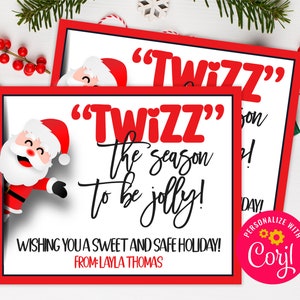 May include: A red and white Christmas card with a cartoon Santa Claus peeking out from the side. The card says "'Twizz' the season to be jolly!" and "Wishing you a sweet and safe holiday! From: Layla Thomas".