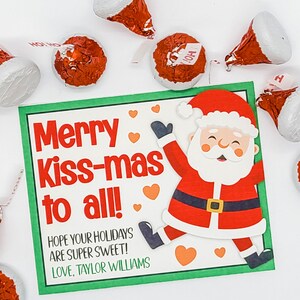 以下が含まれることがあります： 緑と白のクリスマスカードに、キャンディーケーンを持ったサンタクロースの漫画が描かれています。カードには「メリーキス・マス、みんなへ！」と「あなたのホリデーが超甘いものになりますように！愛を込めて、テイラー・ウィリアムズ」と書かれています。