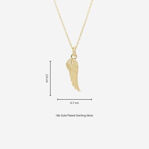 May include: A gold-colored pendant necklace featuring a detailed wing design. The wing pendant measures 0.7 cm wide and 2.0 cm long. The necklace is made of 18k gold plated sterling silver.