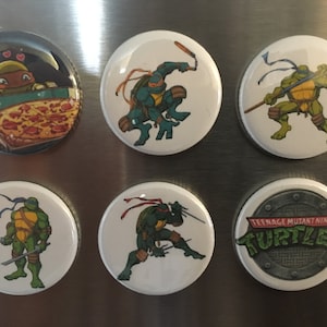 Teenage Mutant Ninja Turtles magnets or pin back buttons. Set of 6.