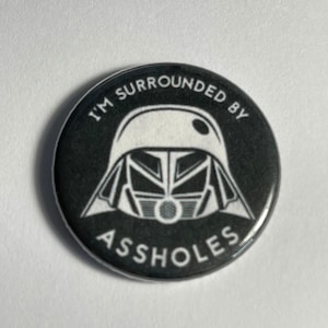 Dark Helmet from Spaceballs!  Im surrounded by! magnets or pin back buttons