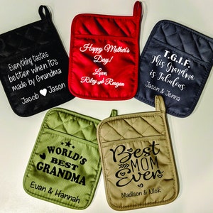 May include: Five quilted oven mitts in various colors, each with a pocket and a loop. The mitts are black, red, navy, olive green, and tan. Each mitt has a different message embroidered in white, such as "Happy Mother's Day!" and "Best Mom Ever."