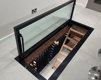 Hinged glass floor wine cellar display unit- Wine storage trap door system