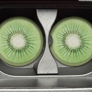 May include: A vintage VHS cassette tape with two kiwi fruit designs on the front.